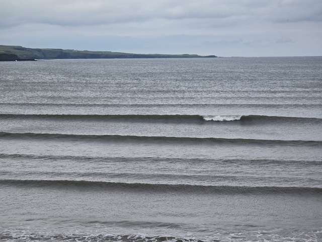 Small clean wave breaking in front of the shop as the tide comes in